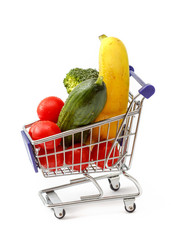 Mixed fruit and vegetables in a mini shopping cart, isolated on