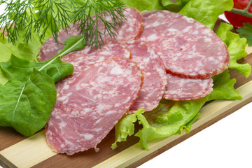 Sausages with salad and basil