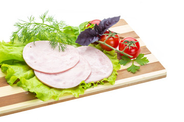 Sausages with salad and basil
