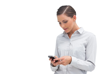 Businesswoman sending text message