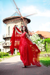 Fototapeta premium Beautiful woman in a bright red dress