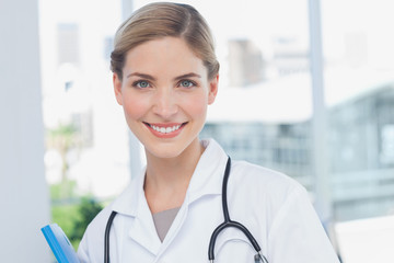 Young nurse holding a folder