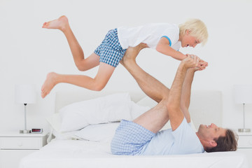 Father holding his son in the air