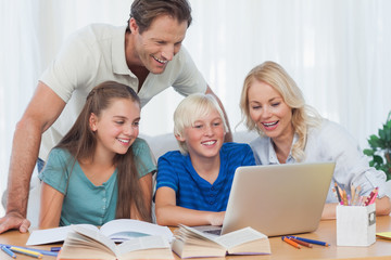 Fototapeta na wymiar Parents and children using a computer