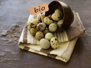 Quail eggs on wooden background