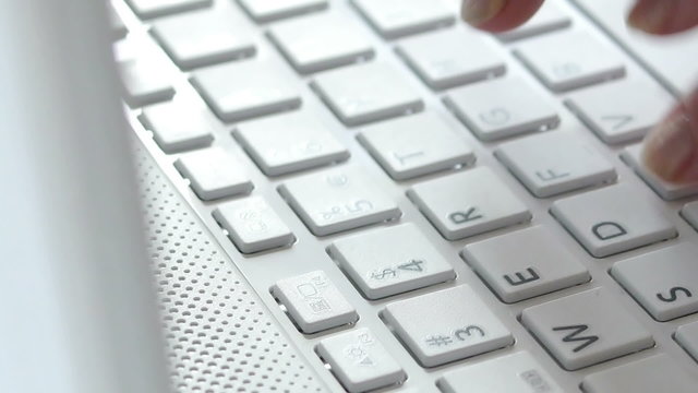 HD - Typing on a Notebook keyboard. Close-up