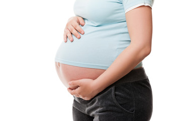 Pregnant woman touching or bonding her abdomen