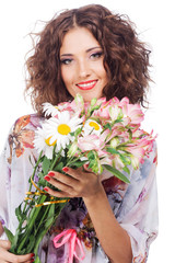 Beautiful happy woman with bouquet of flowers