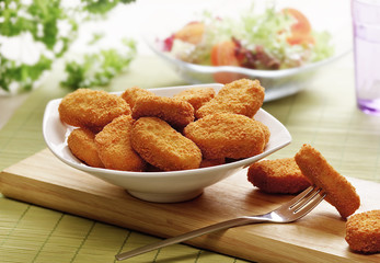 chicken nuggets  in a white bowl