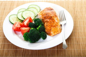 Dinner of Baked Salmon and Fresh Vegetables
