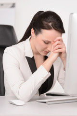 Bad day at office. Depressed middle-aged businesswoman sitting a