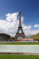 Fototapeta na wymiar Eiffel Tower with city bus in Paris, France