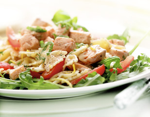 pasta salad with salmon served on a plate