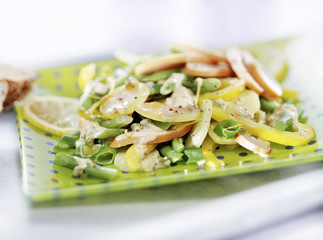 potato salad with dressing served on a plate