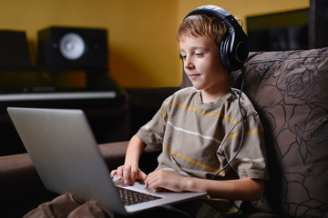 Young kid listening to music and browsing the internet