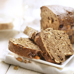 Sliced bread with nuts on a plate