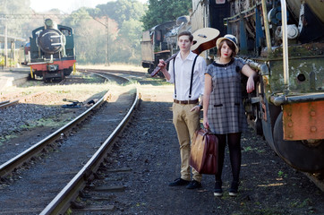 Retro young love couple vintage train setting