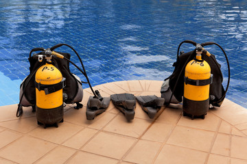 aqualung and flippers near the pool