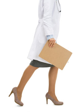 Closeup On Doctor Woman With Clipboard Going Sideways