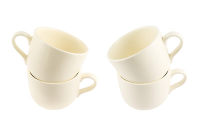 Ceramic cream colored cup pile isolated