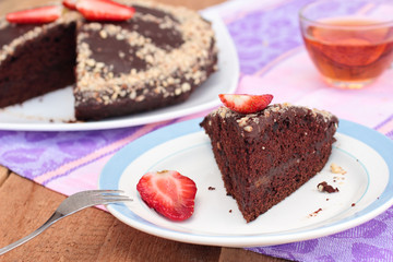 Vegan chocolate cake with almonds and strawberry