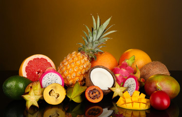 Fototapeta na wymiar Composition of exotic fruits on colorful background
