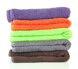 Pile of colorful towels, isolated on white