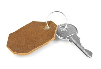 Key with leather trinket isolated on white