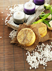 Hand-made soap and sea salt  on grey bamboo mat