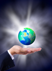 earth globe in hand