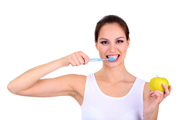 Smiling woman with apple and toothbrush isolated on white