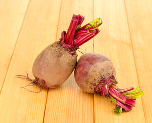 Young beets on wooden table close-up