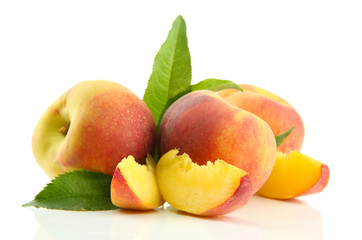 Fototapeta na wymiar Ripe sweet peaches with leaves, isolated on white