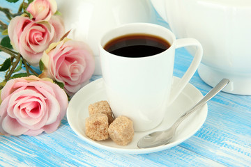 Cup of coffee, on color wooden background