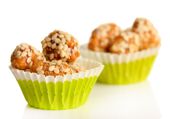 Tasty peanuts with sesame and caramel, isolated on white