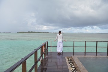 young woman relax on cloudy summer day