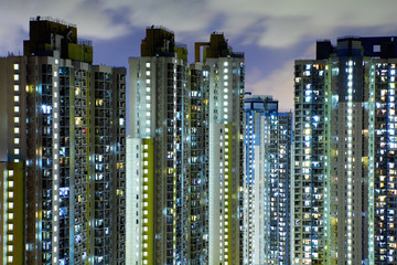 Fototapeta na wymiar Illuminated residential building in Hong Kong