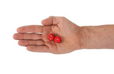 Hand holding red dices