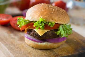 hamburger fast food with plenty of raw materials on the backgrou