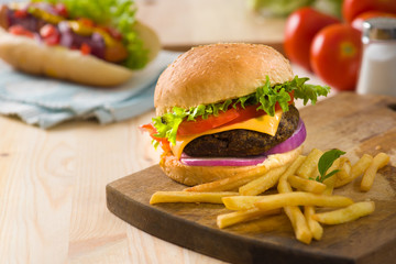hamburger fast food with plenty of raw materials on the backgrou