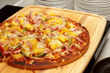 Pizza with diced ham and vegetables