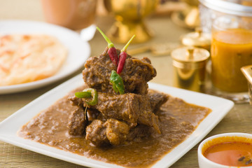 mutton korma famous food with traditional indian background item