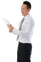  Chinese Asian businessman using tablet-pc standing isolated whi