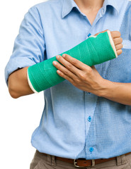 Green cast on an arm of a women isolated