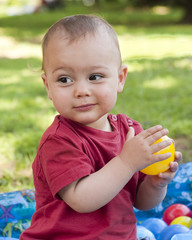 Child playing with balls