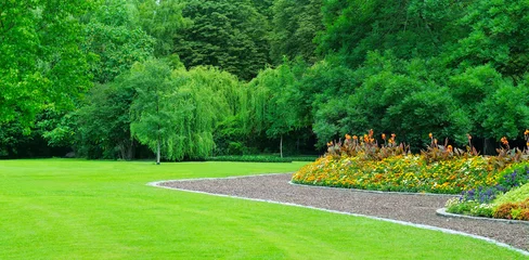  Beautiful flowerbed in summer park © alinamd