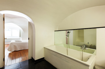 Fototapeta na wymiar hotel in historic palace, interior, view bedroom from bathroom