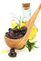 Olives in a wooden spoon 