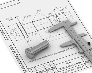 Деталь и штангенциркуль лежат на чертеже