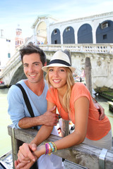 Fototapeta na wymiar Couple of tourists enjoying in Venice
